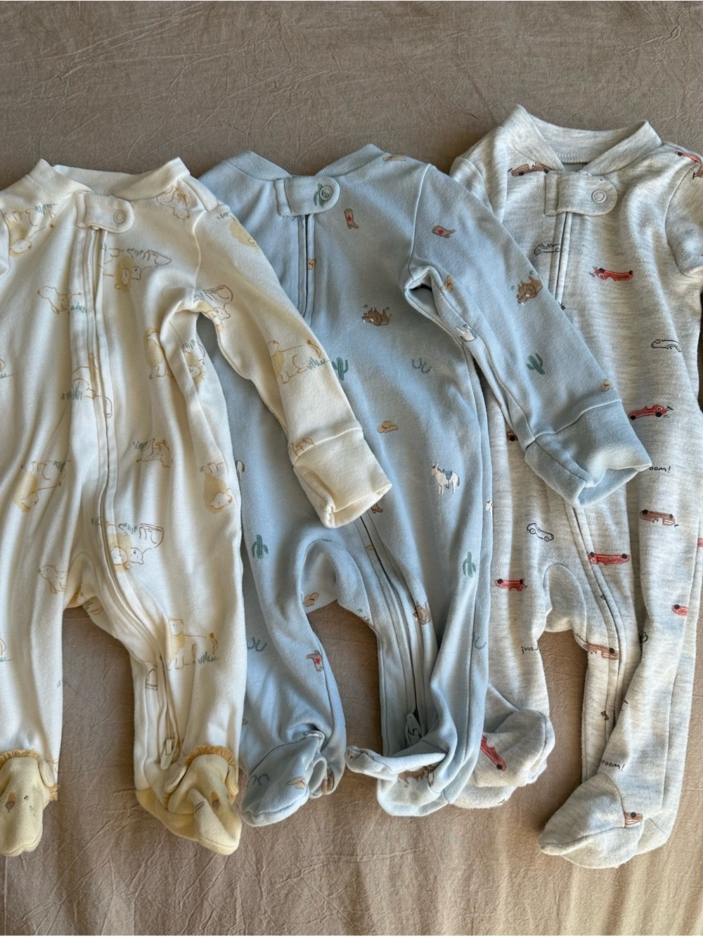 Carter's 3-Pack Footed One-Piece Sleepers in Cream, Light Blue, and Heather Gray